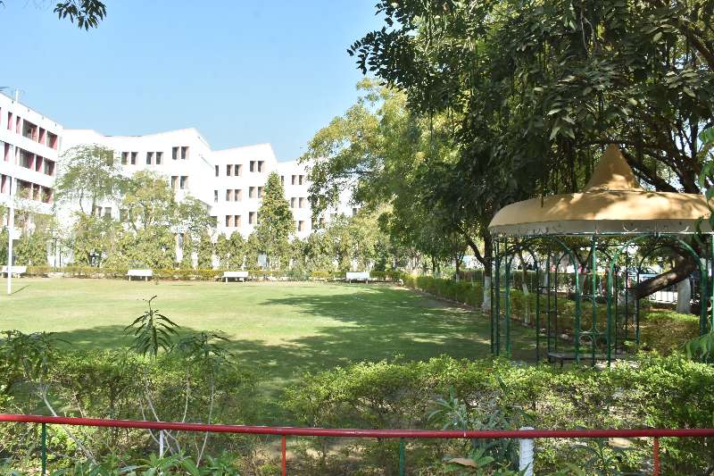 A building and the green grounds of the SKIT Jaipur campus